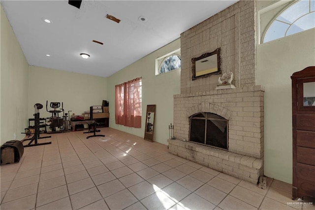 interior space featuring a fireplace and light tile patterned flooring