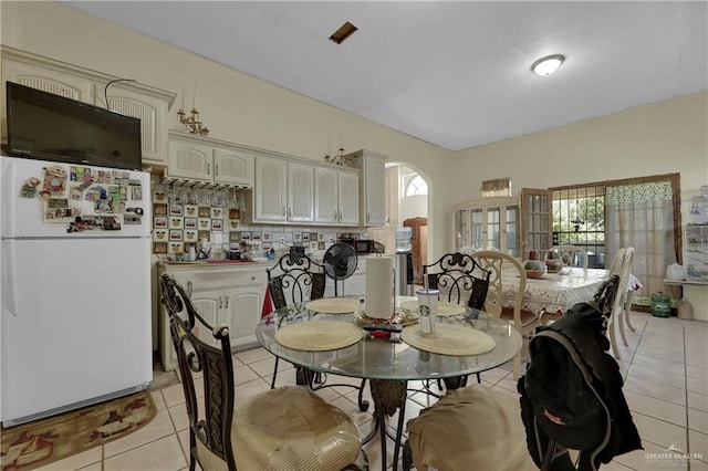 dining space with light tile patterned floors