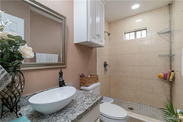 full bath featuring toilet, a shower stall, vanity, and recessed lighting