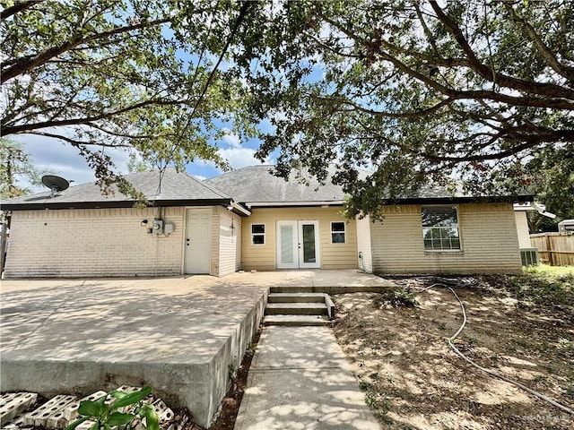 4208 Country St, Edinburg, TX 78541 - view of front of house with french doors, brick siding, and a patio area