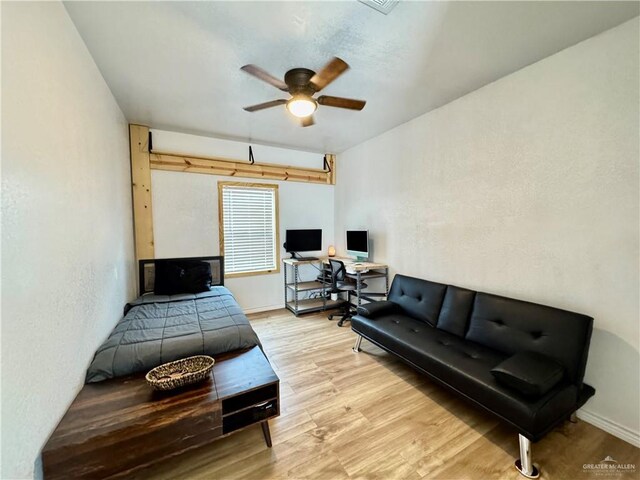 4208 Country St, Edinburg, TX 78541 - bedroom featuring a desk, wood finished floors, baseboards, and a ceiling fan