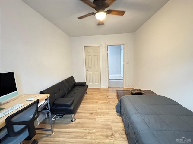 4208 Country St, Edinburg, TX 78541 - bedroom with light wood-style flooring, baseboards, a ceiling fan, and an office area