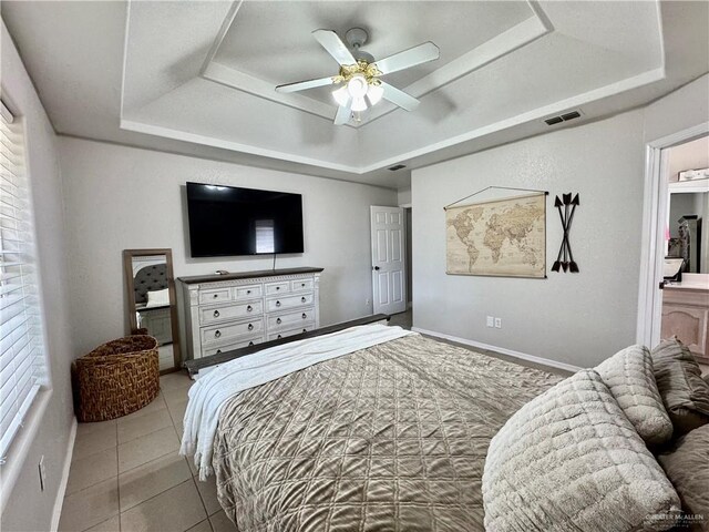 4208 Country St, Edinburg, TX 78541 - tiled bedroom with a tray ceiling, baseboards, and a ceiling fan