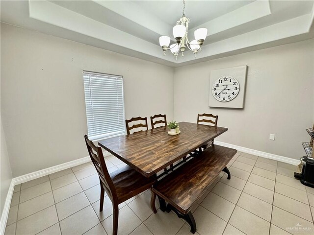 4208 Country St, Edinburg, TX 78541 - dining room featuring a raised ceiling, a chandelier, light tile patterned floors, and baseboards