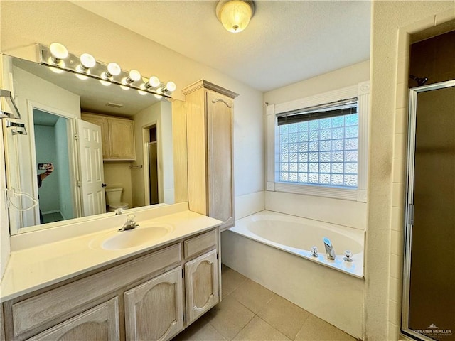 4208 Country St, Edinburg, TX 78541 - bathroom with a bath, vanity, toilet, a stall shower, and tile patterned floors