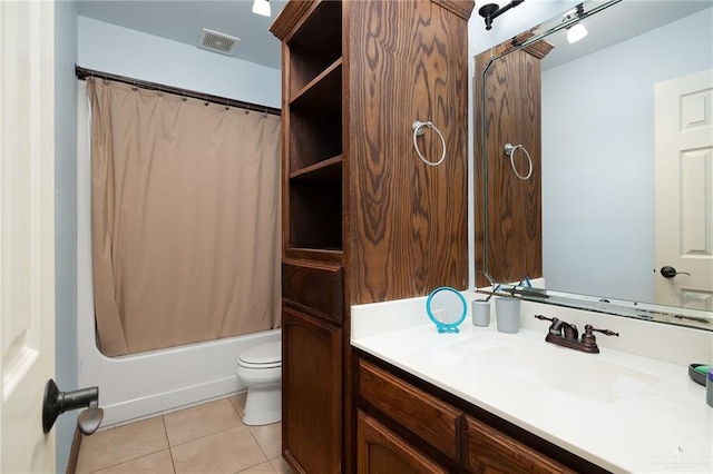 full bathroom with tile patterned flooring, vanity, shower / tub combo, and toilet