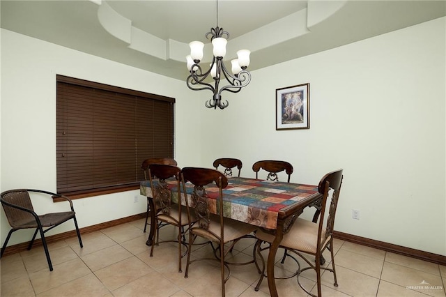 tiled dining area with a notable chandelier