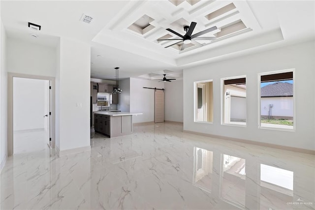 unfurnished living room featuring visible vents, ceiling fan, a barn door, marble finish floor, and coffered ceiling