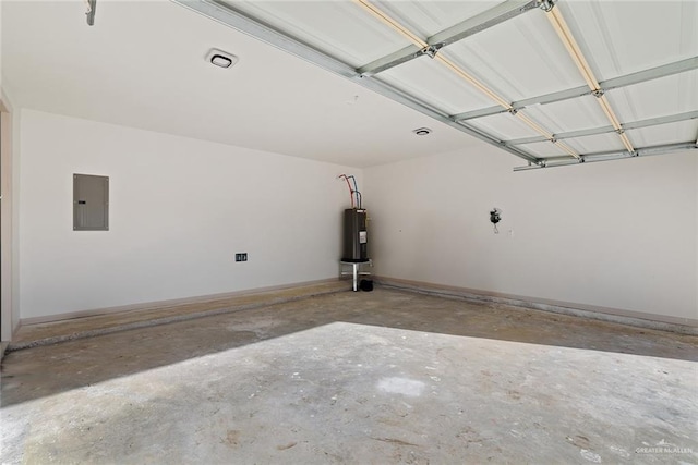 garage featuring water heater, baseboards, and electric panel