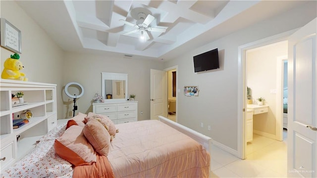 843 Brady Ave, Alamo, TX 78516 - bedroom with a ceiling fan, connected bathroom, light tile patterned floors, a raised ceiling, and coffered ceiling