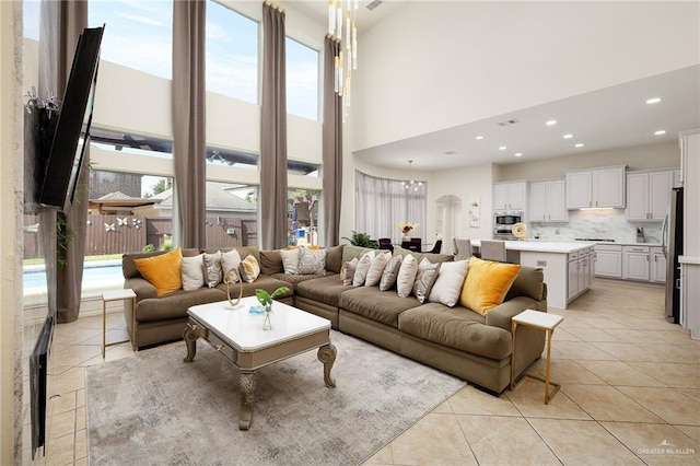 2800 San Ricardo St, Mission, TX 78572 - living area featuring light tile patterned floors, a high ceiling, recessed lighting, and a chandelier