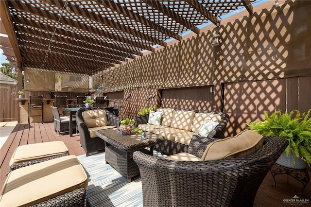 2800 San Ricardo St, Mission, TX 78572 - wooden deck with outdoor lounge area, a pergola, an outdoor kitchen, and outdoor dining space