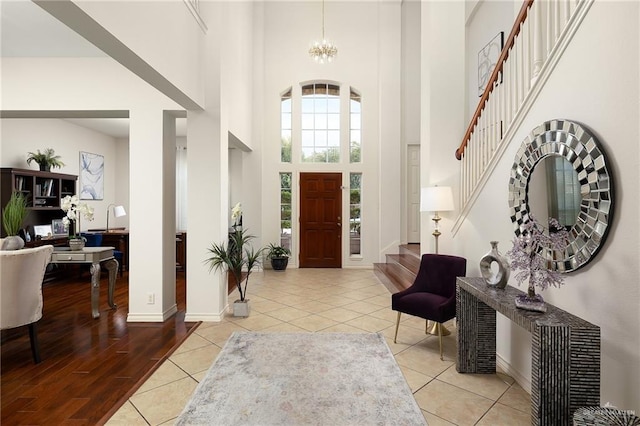 2800 San Ricardo St, Mission, TX 78572 - foyer entrance with a towering ceiling, stairs, tile patterned flooring, and a chandelier