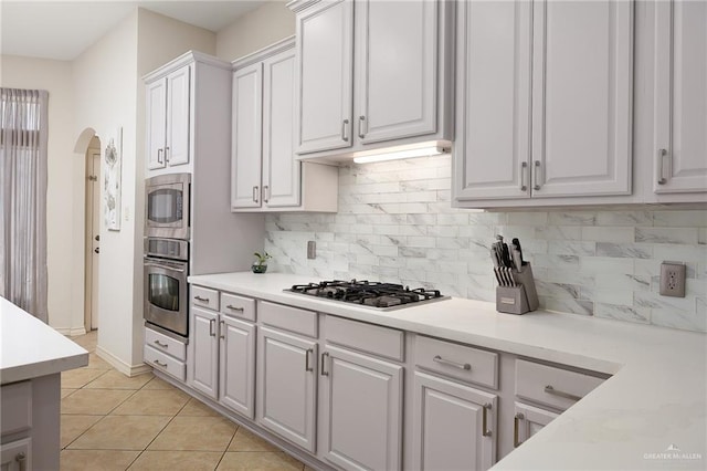 2800 San Ricardo St, Mission, TX 78572 - kitchen with appliances with stainless steel finishes, white cabinetry, light countertops, and backsplash