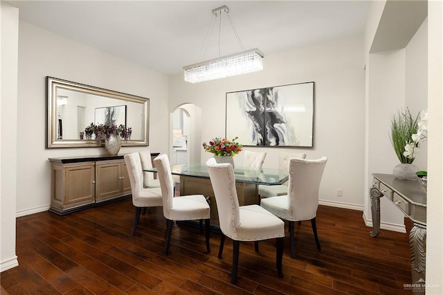 2800 San Ricardo St, Mission, TX 78572 - dining room featuring arched walkways and dark wood-type flooring