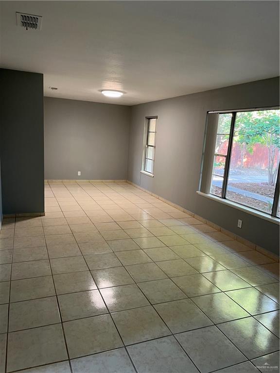 unfurnished room with light tile patterned floors