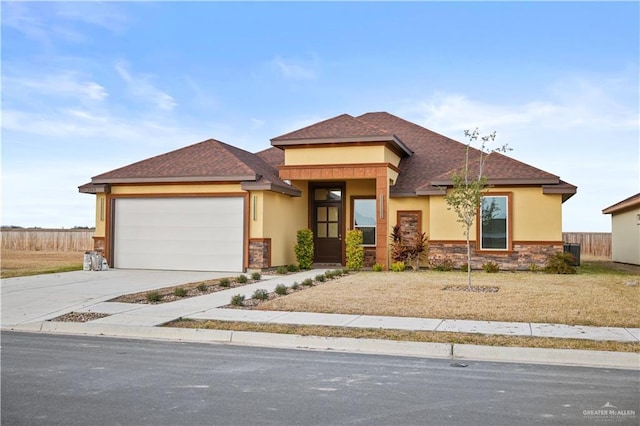 prairie-style house featuring a garage