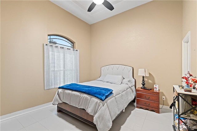 tiled bedroom with vaulted ceiling and ceiling fan