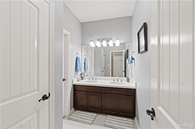 bathroom with vanity and tile patterned flooring