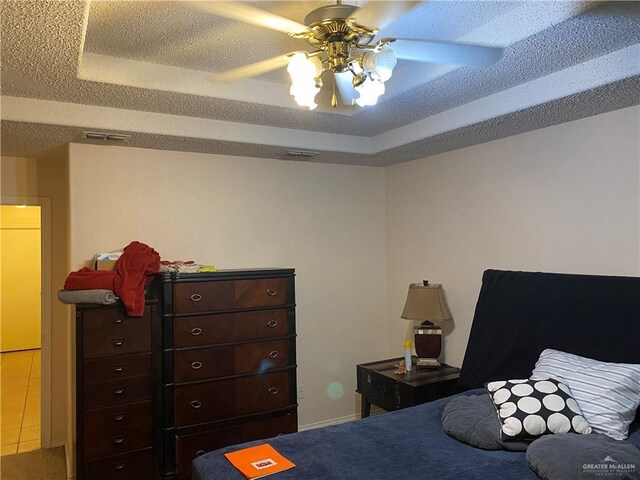 2500 W Xanthisma Ave, Mcallen, TX 78504 - carpeted bedroom with ceiling fan and a raised ceiling