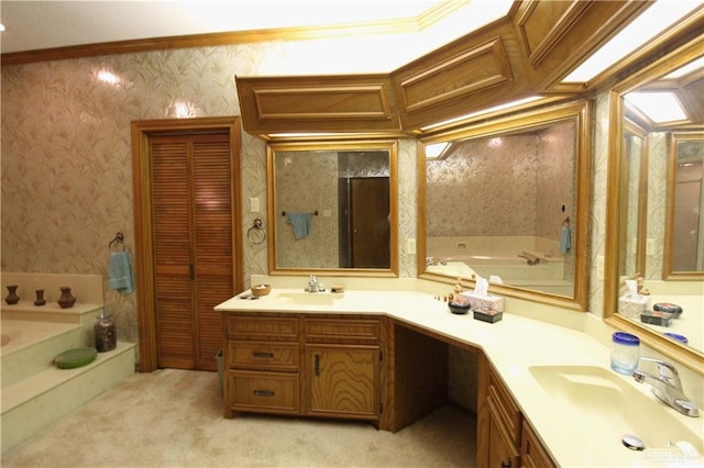 bathroom with vanity, a bath, and crown molding