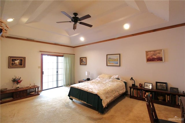 carpeted bedroom featuring access to exterior, a raised ceiling, and ceiling fan