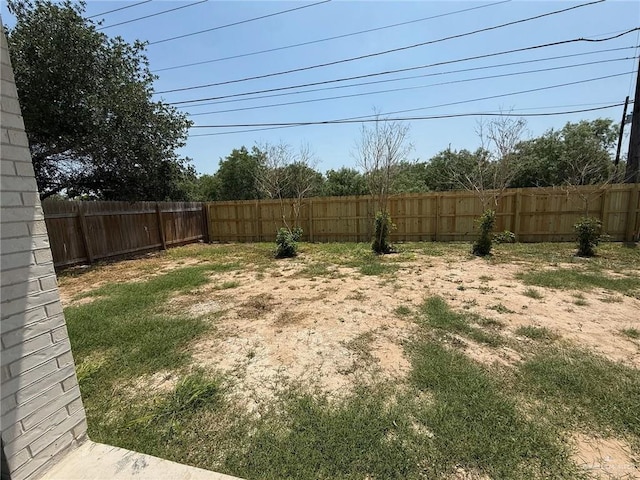 view of yard with a fenced backyard