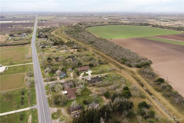 birds eye view of property featuring a rural view