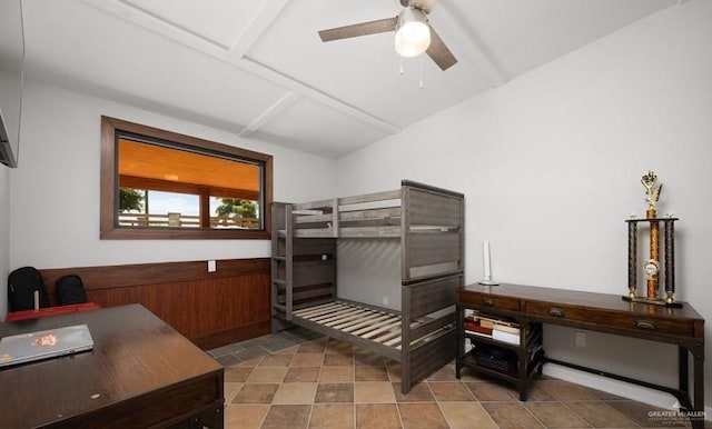 bedroom with ceiling fan and light tile patterned floors