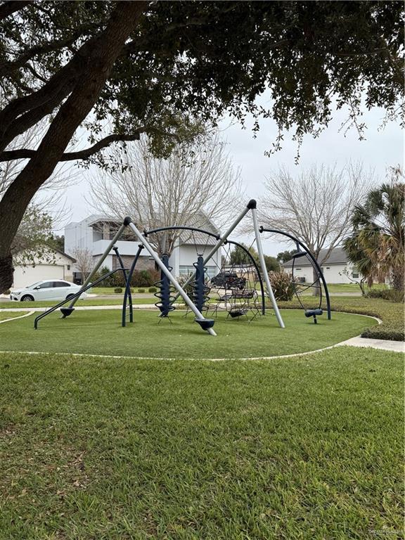 view of community featuring a lawn and playground community