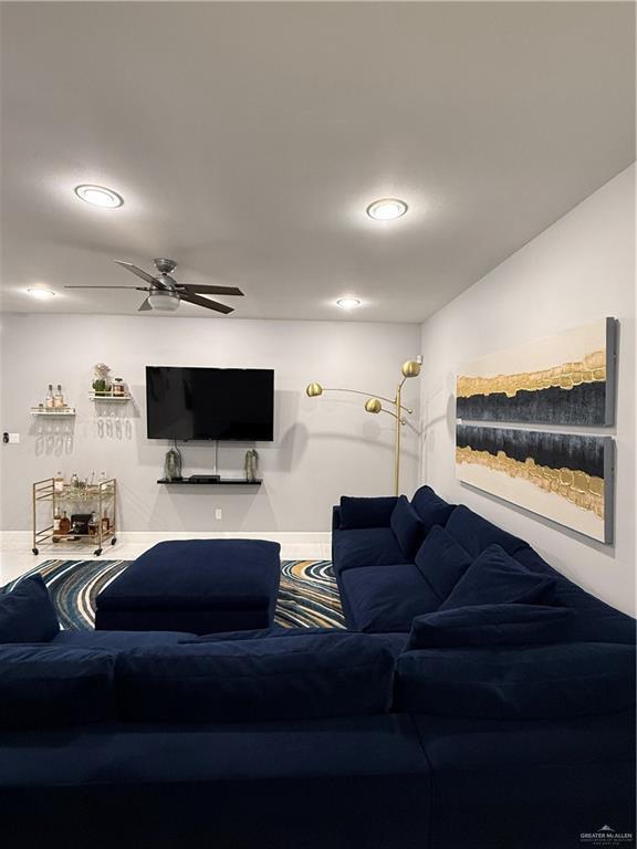 living area with recessed lighting and ceiling fan