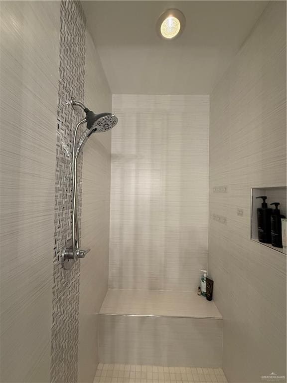 full bathroom with tiled shower