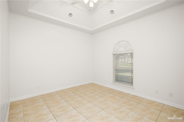3213 Academy Ave, Edinburg, TX 78541 - empty room featuring a raised ceiling, a ceiling fan, and tile patterned floors