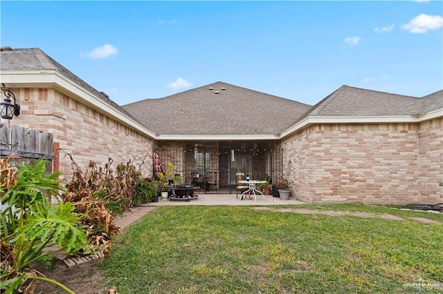 3213 Academy Ave, Edinburg, TX 78541 - back of property with a patio, brick siding, and a shingled roof