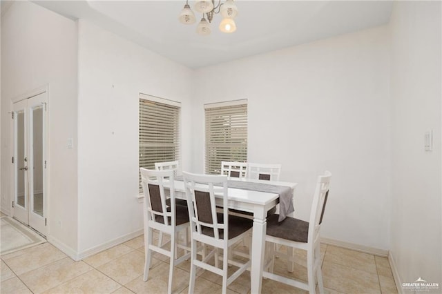3213 Academy Ave, Edinburg, TX 78541 - dining area featuring a chandelier and tile patterned flooring