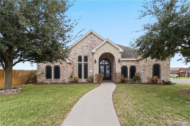3213 Academy Ave, Edinburg, TX 78541 - french country style house featuring brick siding