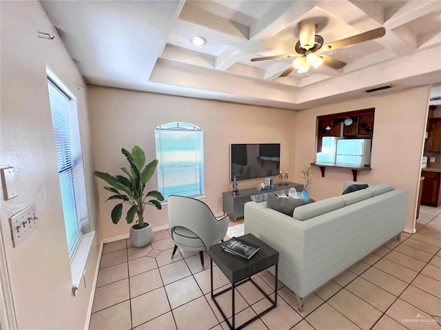 tiled living room featuring ceiling fan and coffered ceiling