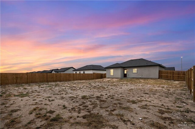 view of yard at dusk