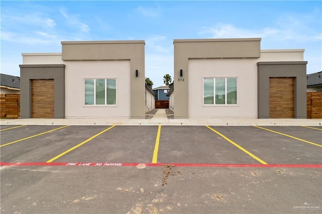 view of parking featuring a garage