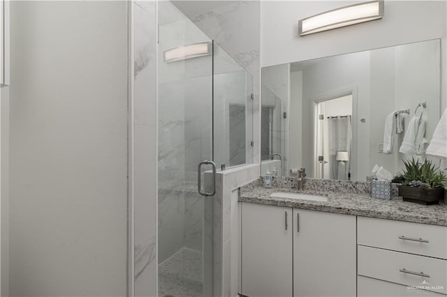 901 E Yuma Ave Unit 504, Mcallen, TX 78503 - bathroom featuring vanity and a marble finish shower