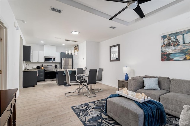 901 E Yuma Ave Unit 504, Mcallen, TX 78503 - living room featuring light wood-type flooring, ceiling fan, recessed lighting, and baseboards