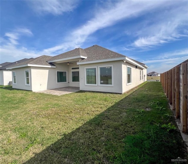 2309 S Cartier Dr, Edinburg, TX 78542 - rear view of house with stucco siding, roof with shingles, and a patio