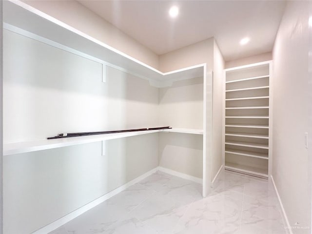 2309 S Cartier Dr, Edinburg, TX 78542 - walk in closet featuring marble look tile flooring