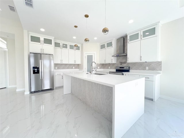 2309 S Cartier Dr, Edinburg, TX 78542 - kitchen with stainless steel appliances, wall chimney range hood, a sink, light marble finish floors, and backsplash