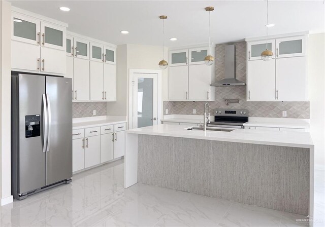 2309 S Cartier Dr, Edinburg, TX 78542 - kitchen featuring stainless steel appliances, wall chimney exhaust hood, a sink, tasteful backsplash, and light countertops