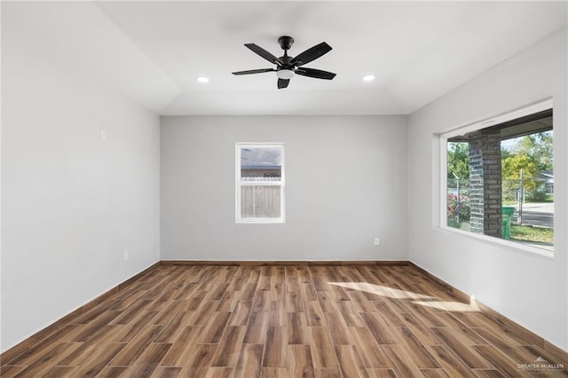 spare room featuring ceiling fan and hardwood / wood-style floors