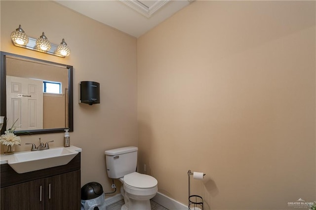 bathroom featuring vanity and toilet