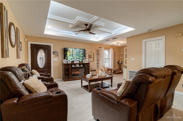 living room featuring coffered ceiling, beamed ceiling, and ceiling fan