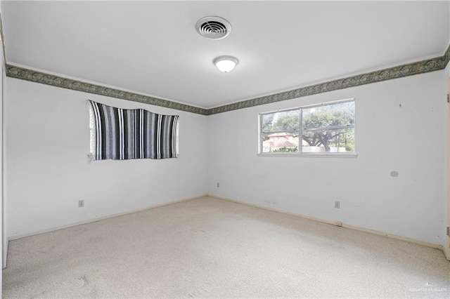 207 E Jackson Ave, Mcallen, TX 78501 - carpeted empty room with baseboards