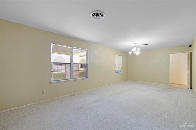 207 E Jackson Ave, Mcallen, TX 78501 - unfurnished room with a chandelier and light carpet